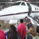 NASA Langley Research Center personnel showed 2022 Blue Skies Forum participants how the remote controlled electric tug works to move aircraft from the hangar.